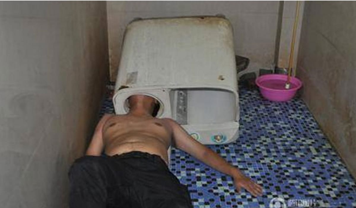  Chinese Man Tries To Fix Washing Machine, Gets His Head Stuck In It