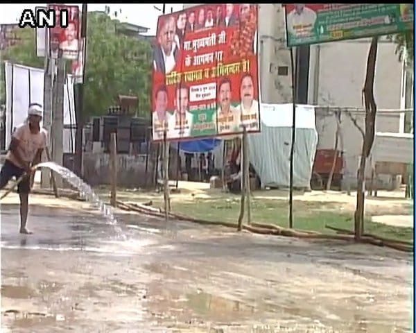  Water being used to settle dust at CM Akhilesh Yadav's venue in Barabanki's Fatehpur town.