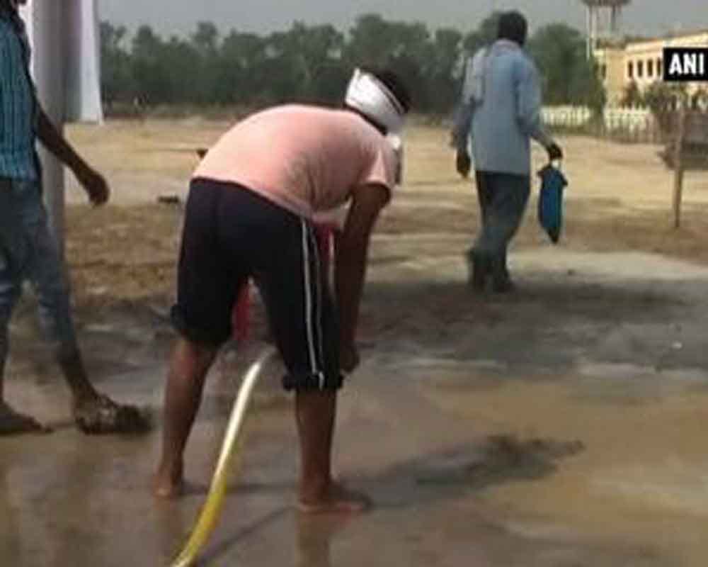 Water being used to settle dust at CM Akhilesh Yadav's venue in Barabanki's Fatehpur town.