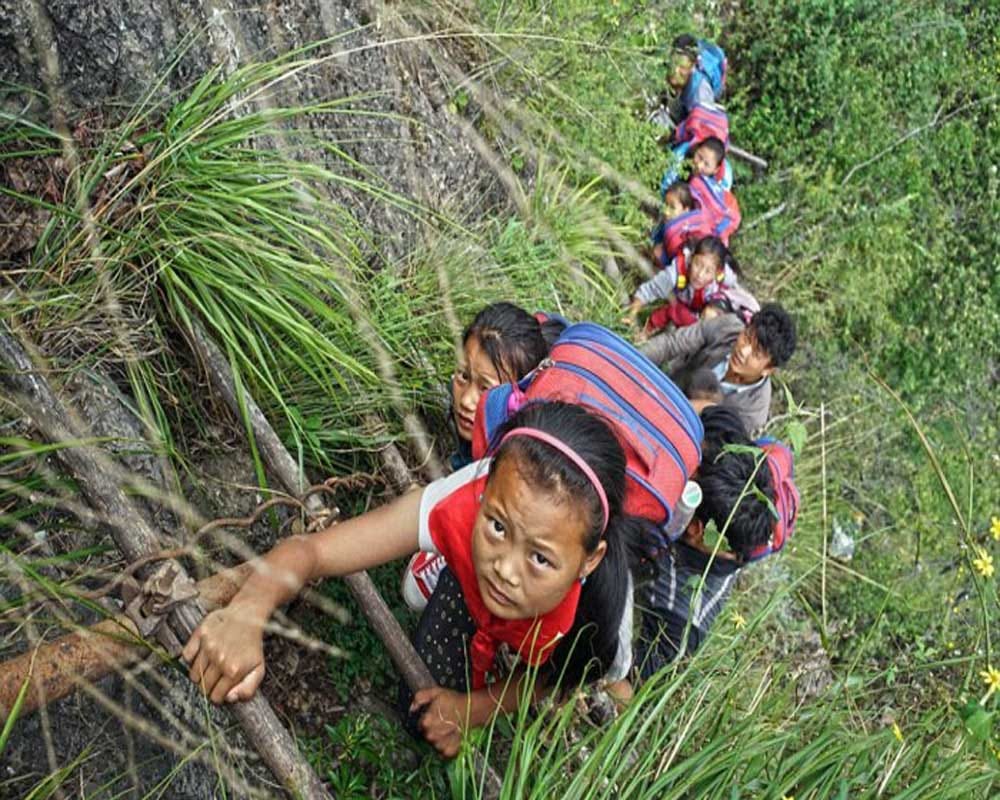 Students Climb Thousands Foot Cliff To Attend School