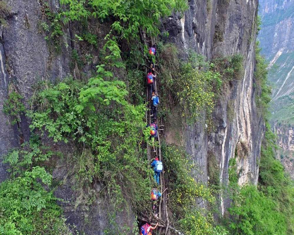 Students Climb Thousands Foot Cliff To Attend School