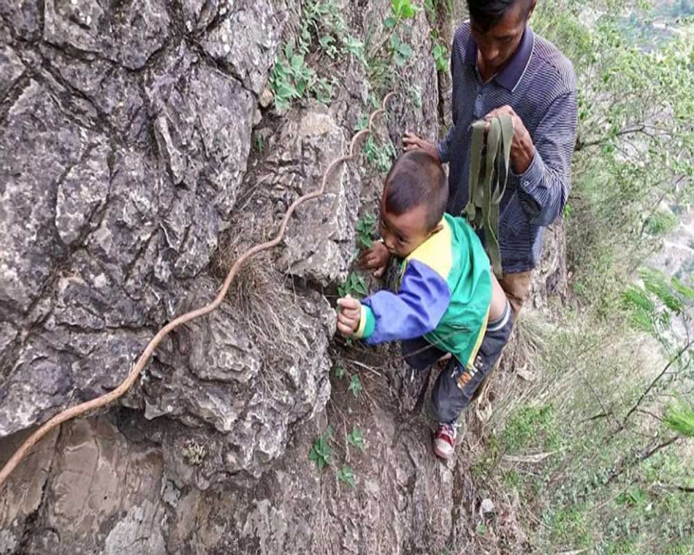 Students Climb Thousands Foot Cliff To Attend School