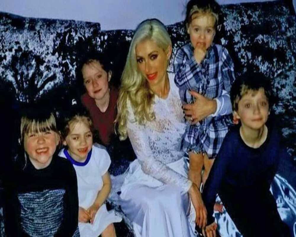 a mother of five children with figure like a model