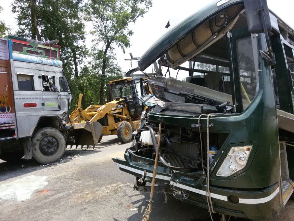 bus-truck collapse, two injured