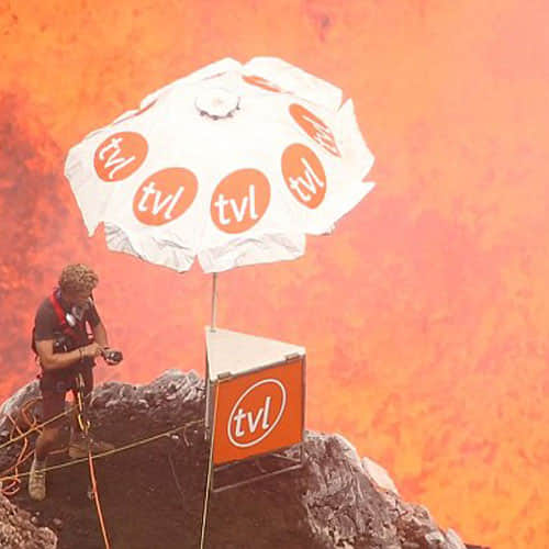 this man inside a volcano chatting on his mobile 