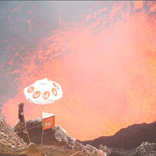 this man inside a volcano chatting on his mobile 