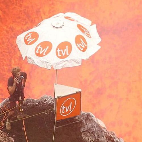 this man inside a volcano chatting on his mobile 