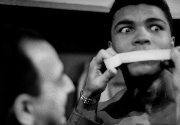 Muhammad Ali who threw olympic medal in river