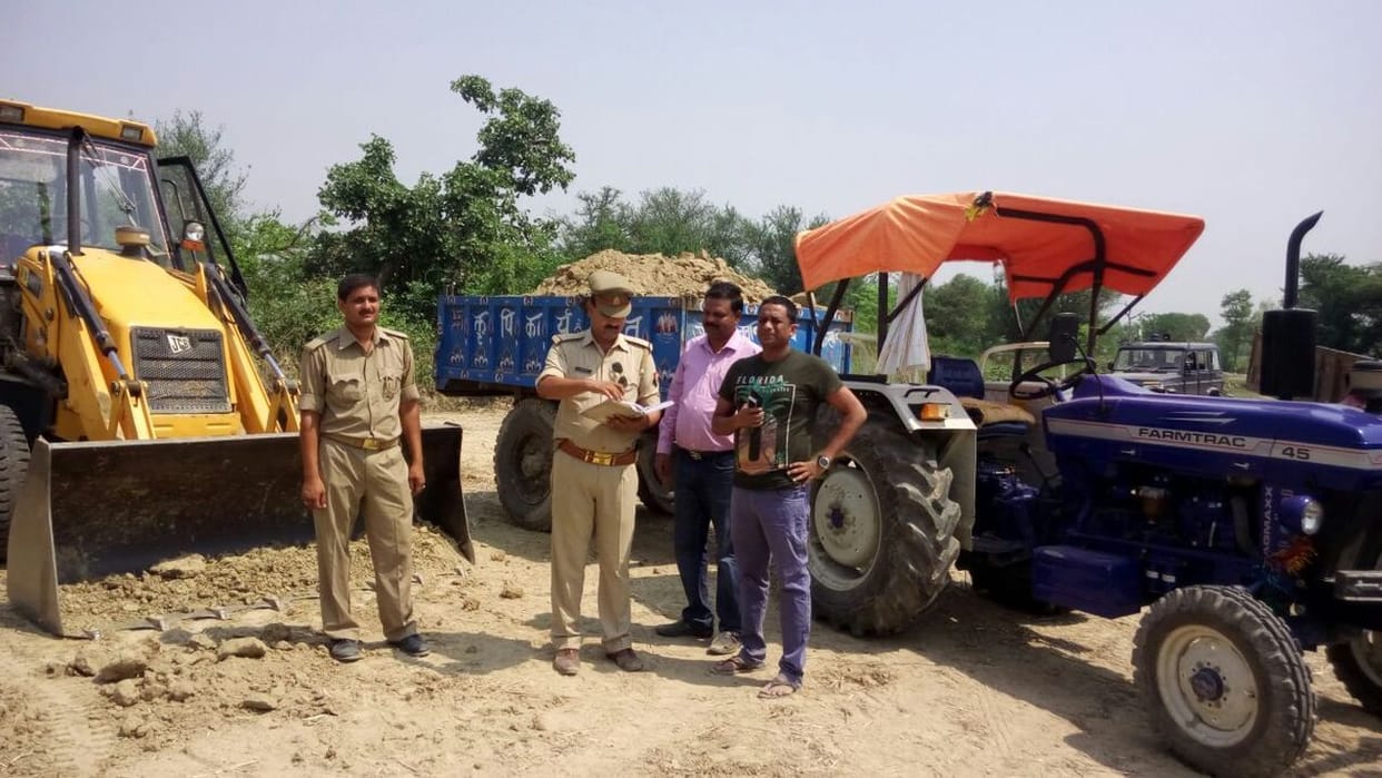 JCB and tractor-trolley caught engaged in mining