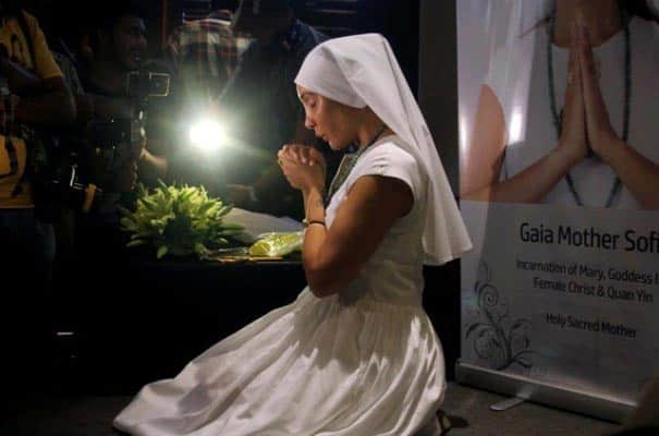 Sofia Hayat shows her breast implants at a press conference