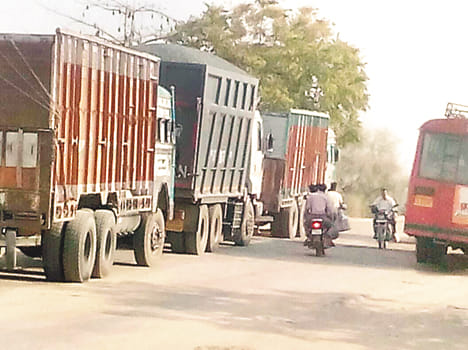  overloaded trucks on road at auraiya