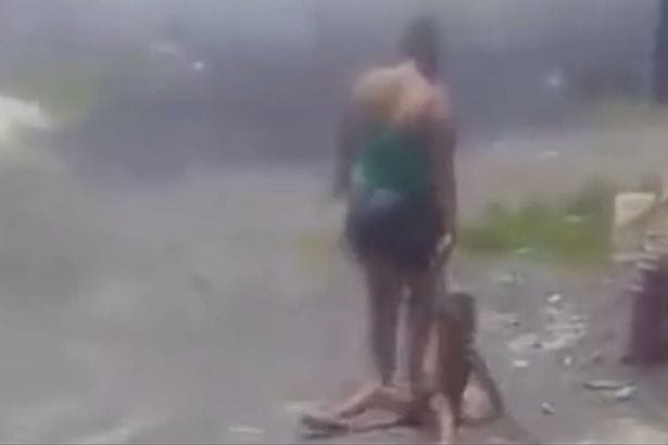 'Evil mum' pins child down with her foot, shocking video.