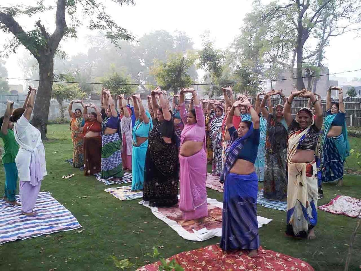 A large number of people participating in yoga classes