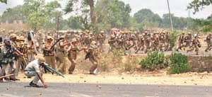 By carcass blockade , stones and batons