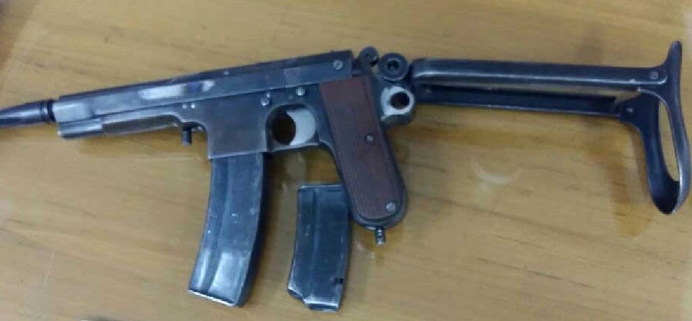 gangster gadgoo held with lazor and US army pistol