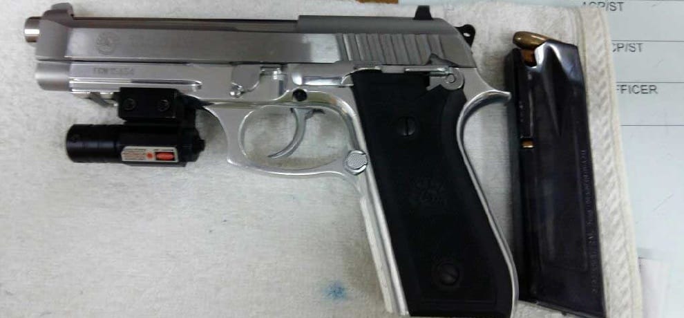 gangster gadgoo held with lazor and US army pistol