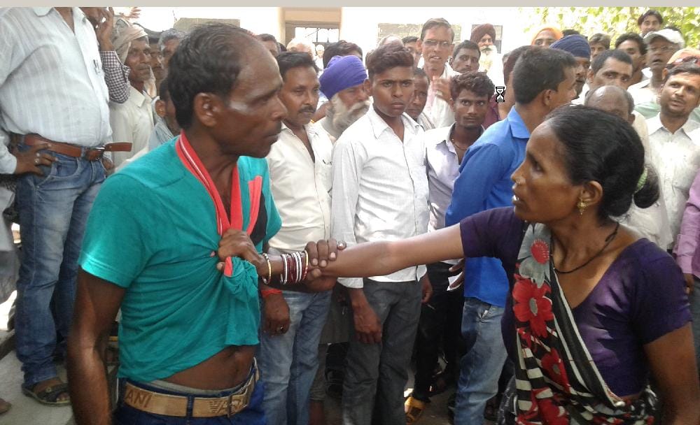 Angry woman beaten by her husband from the sale of land