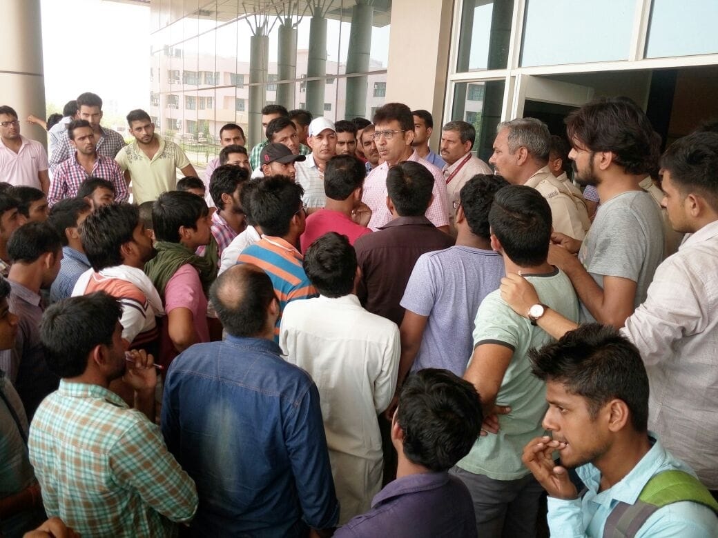 rohtak, mdu, students ruckus in opposition to vaccent the hostel , protest, haryana