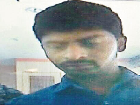 Tppebaji photographs of the suspect at the ATM