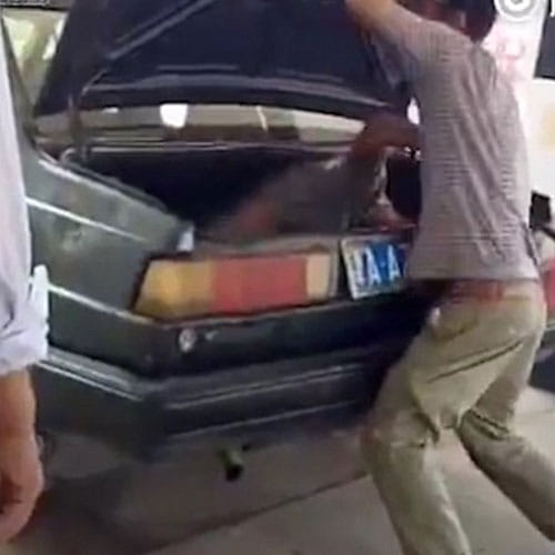 chinese man beating her wife