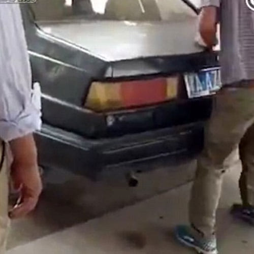 chinese man beating her wife