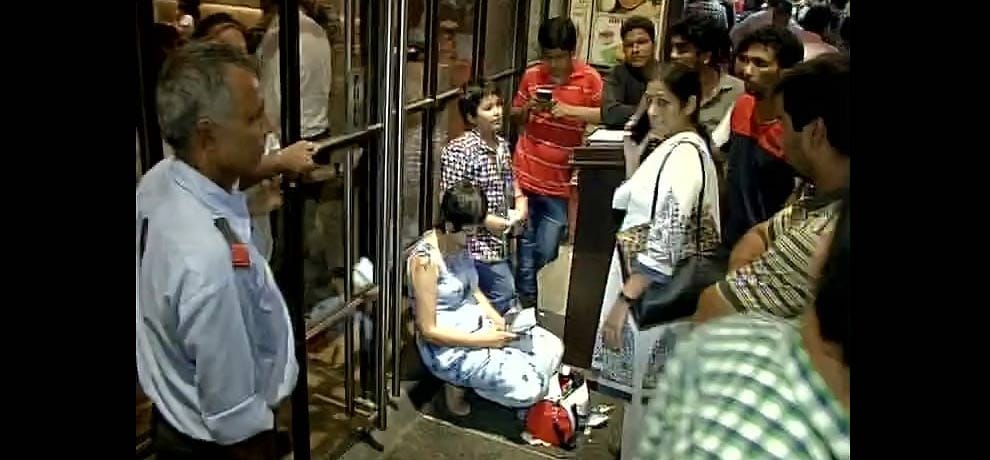  Woman protest outside a restaurant after the restaurant allegedly denied entry to poor children