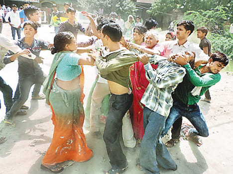 Pregnant and her husband beaten by family members