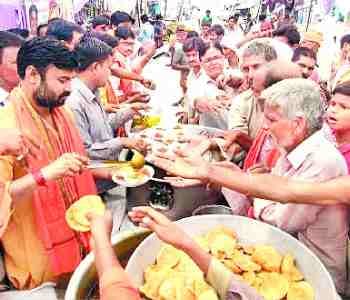 Pilgrims perform worship in temples