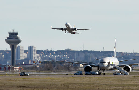 Woman gives birth on PLANE forcing emergency landing at Heathrow Airport