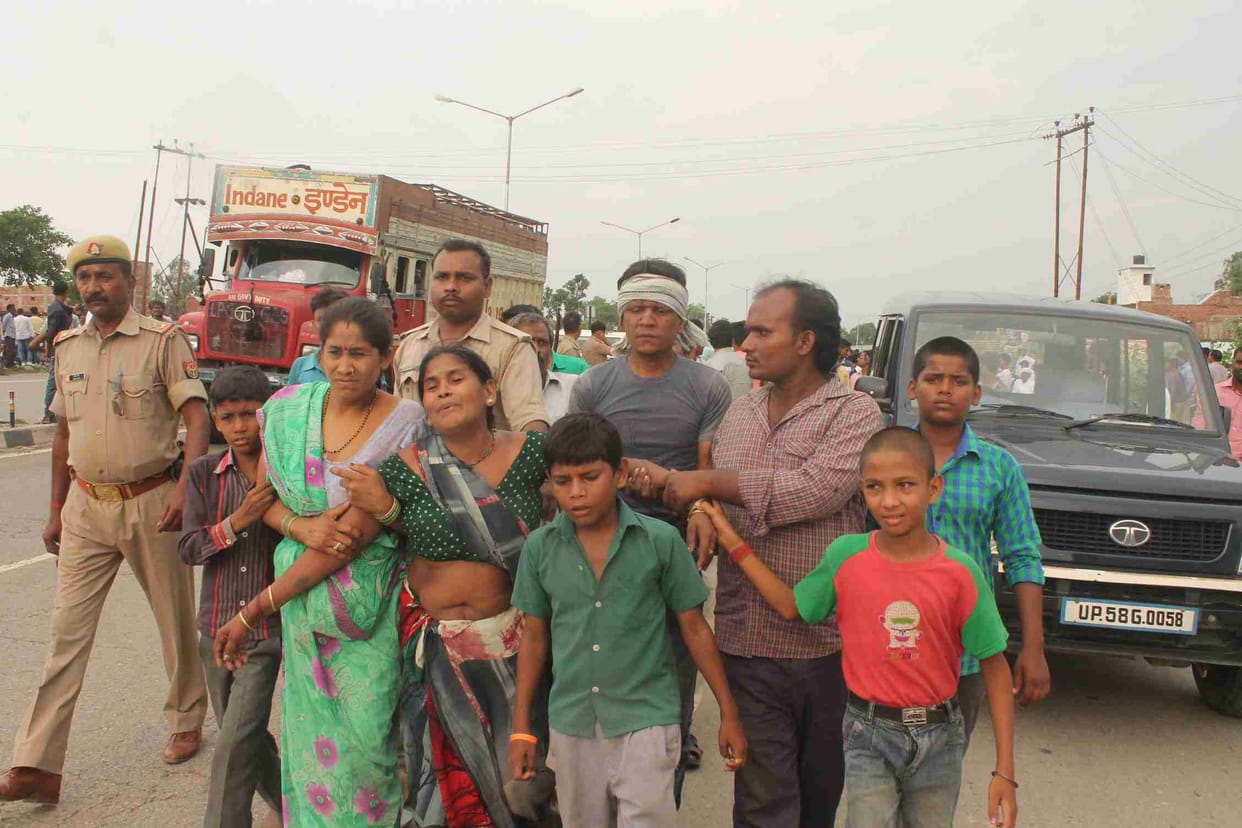 young men crushed under bus, dead
