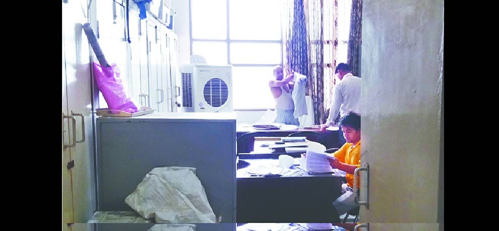 Employees working in the office shirt off