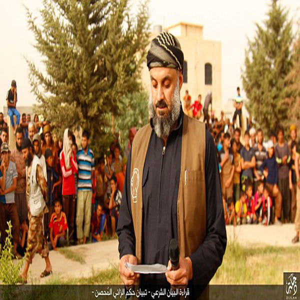 ISIS militants savagely stoning four married men to death for 'committing adultery' in Iraq