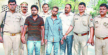 Two robbers arrested , one at large