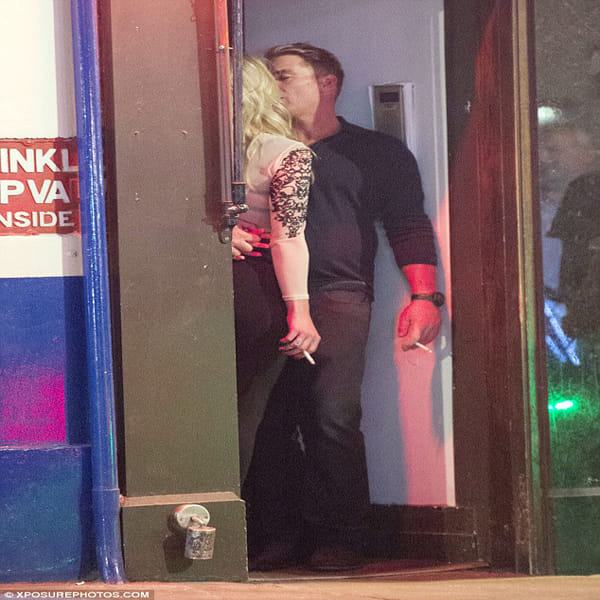 Cricketer Shane Warne shares a steamy smooch kissing in dingy doorway with mystery blonde in London