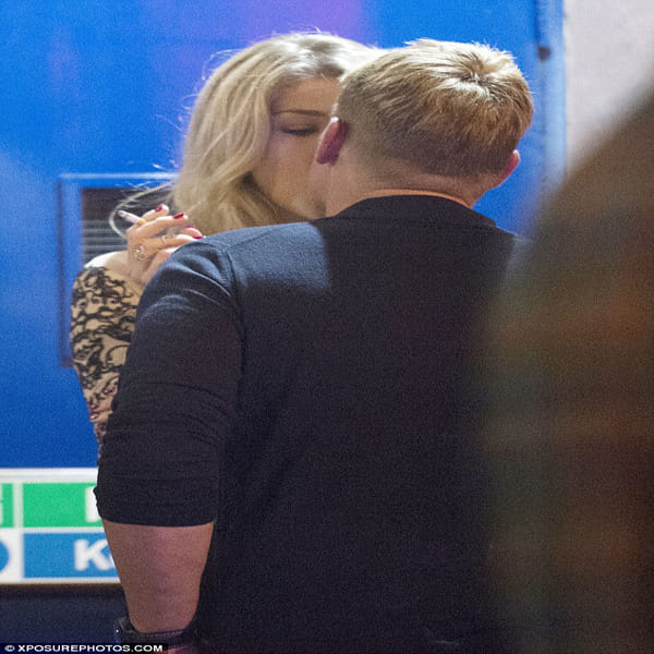 Cricketer Shane Warne shares a steamy smooch kissing in dingy doorway with mystery blonde in London