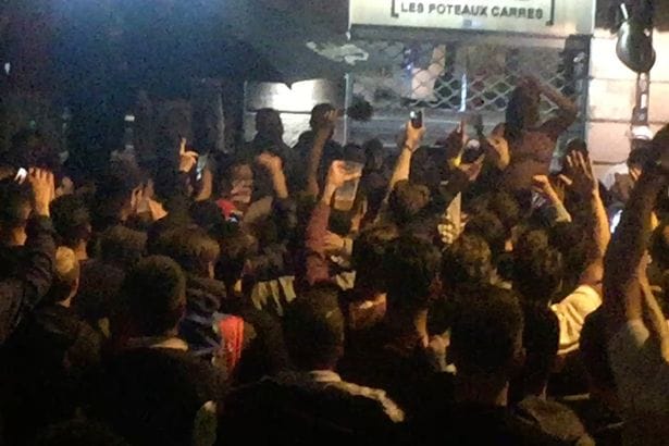 Female Singer at the demand of the audience on stage and off clothes , watched police