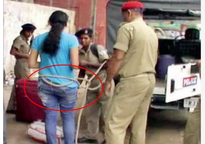 Jharkhand: police tie up girl with rope
