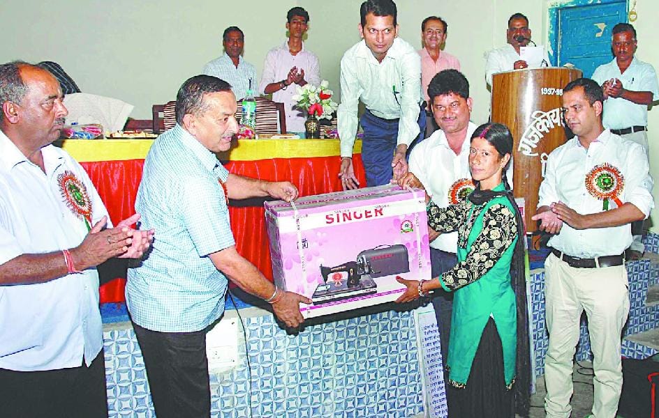 Workers distributing tool kits, sewing machine