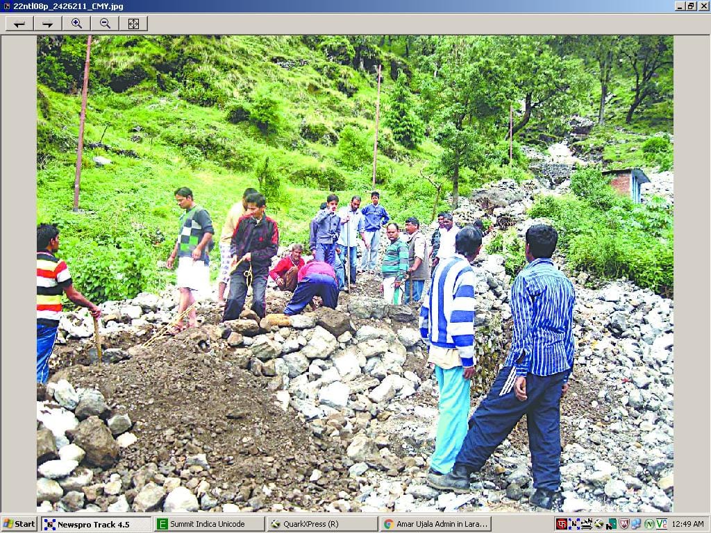 Open drains are labor, removing boulders and stones
