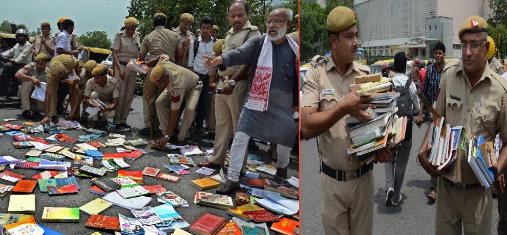 Teachers books wind up on the road between the police by throwing crushed