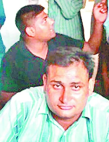 Holding fake excise constable, beat