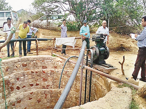 Hand pumps and pond excavation work in team