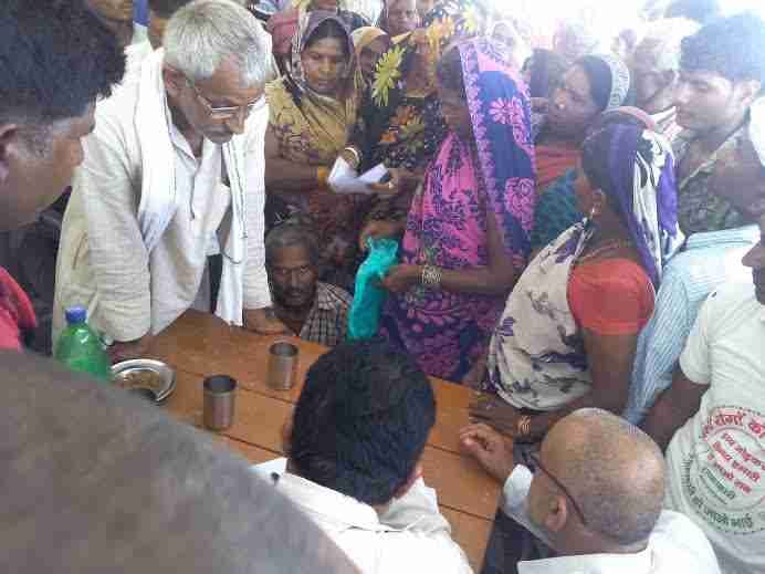 Villagers investigating officer hoop