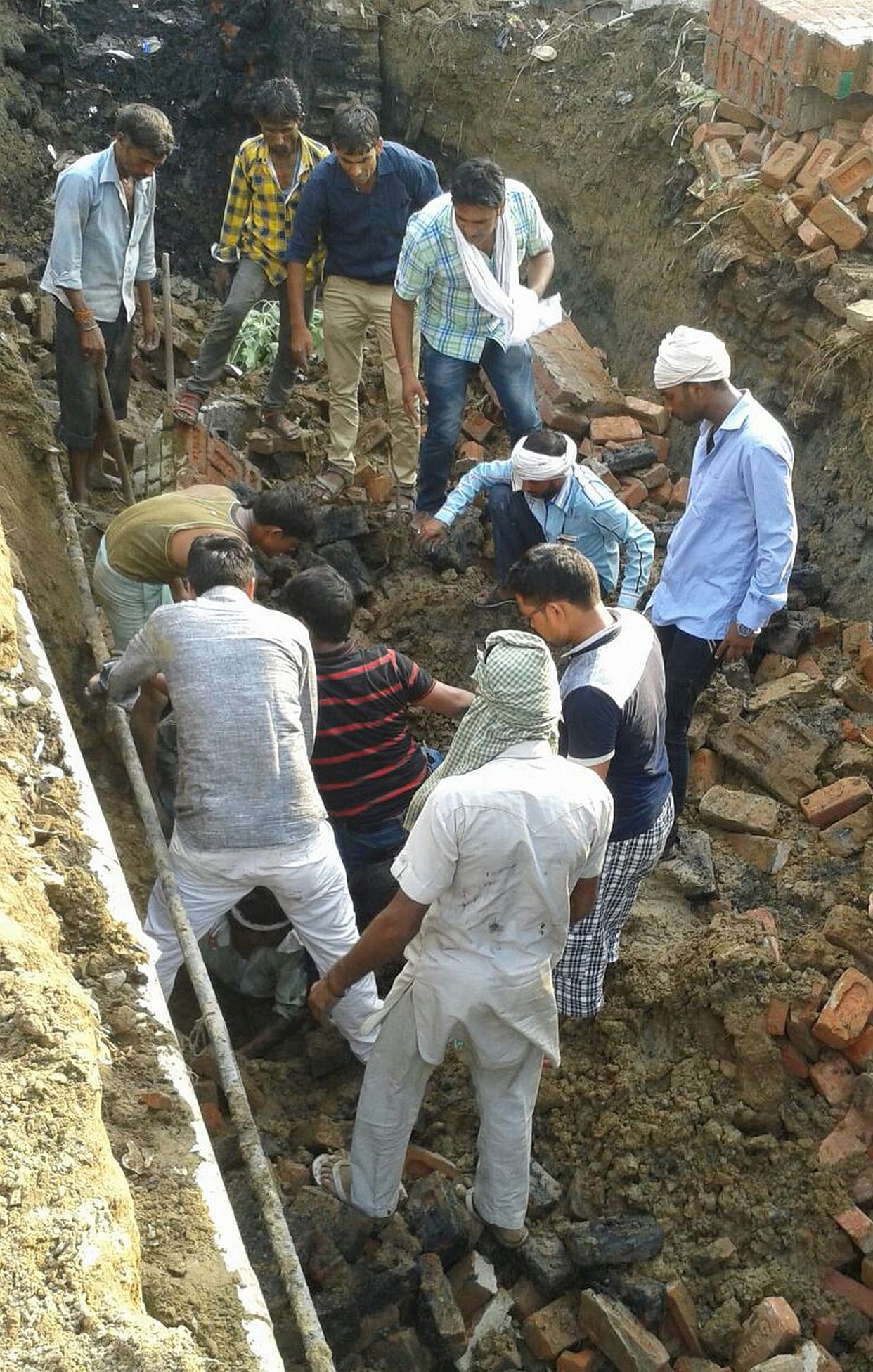 Worker buried in soil.