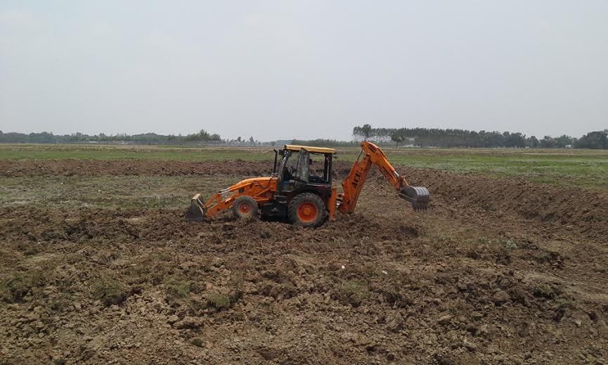 Being routed pond digging JCB