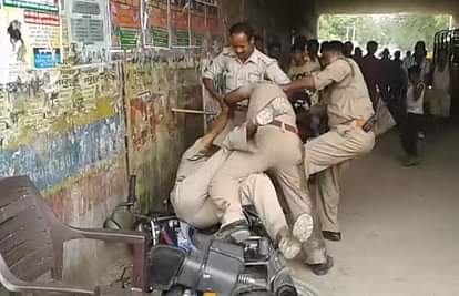 Police personnel fighting each other for bribe money