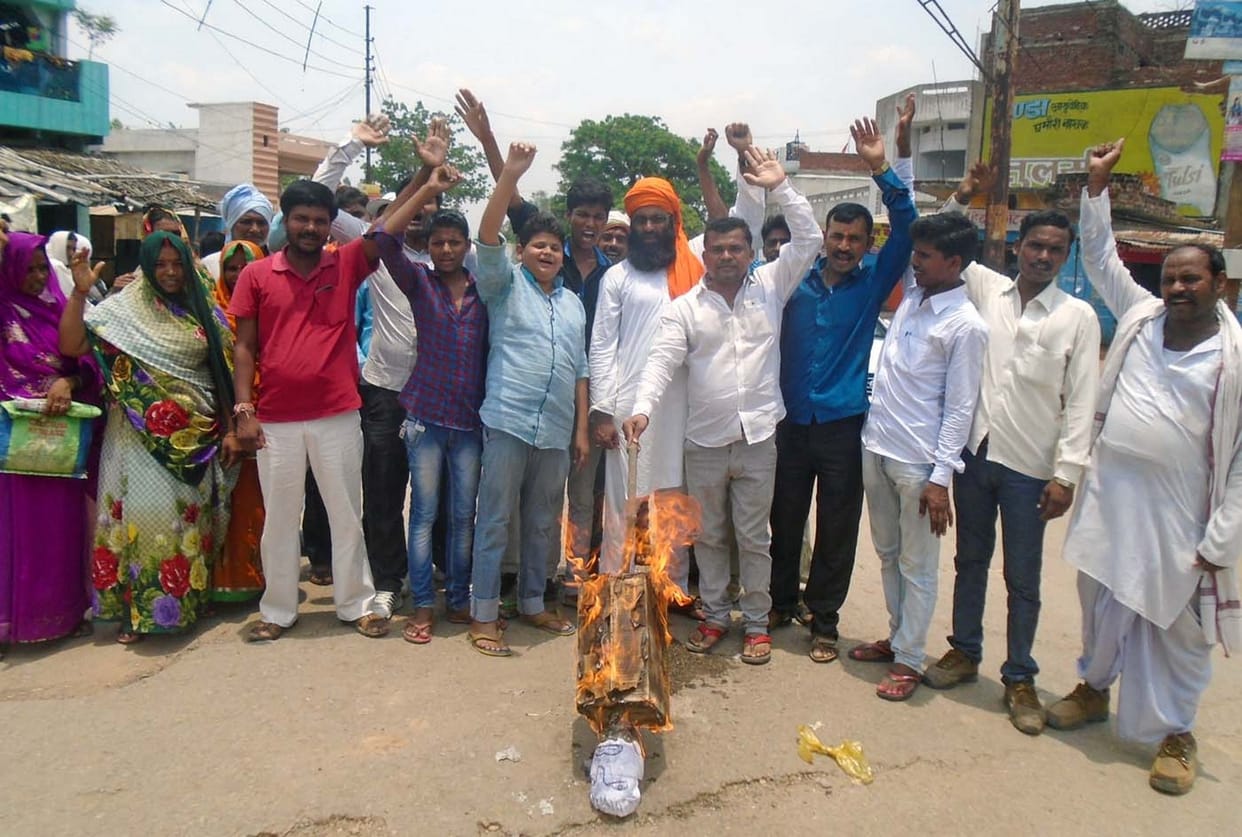 The minister's effigy burnt slogan