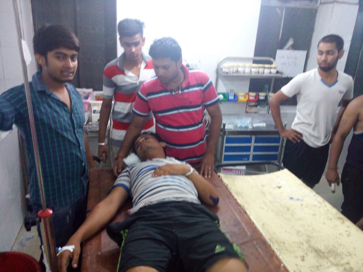 half dozen people attack on other community man.