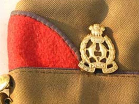 Beaten policeman, uniform opened