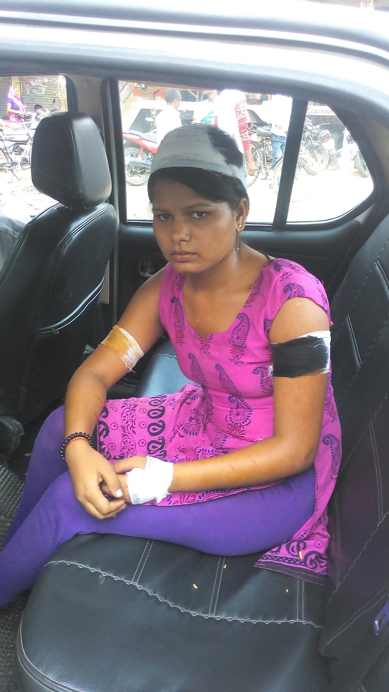 A girl student face bravely to attackers.